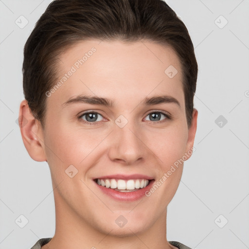 Joyful white young-adult female with short  brown hair and grey eyes