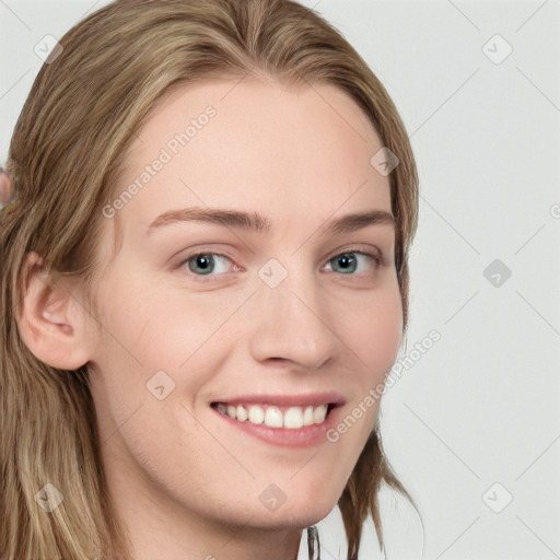 Joyful white young-adult female with long  brown hair and blue eyes