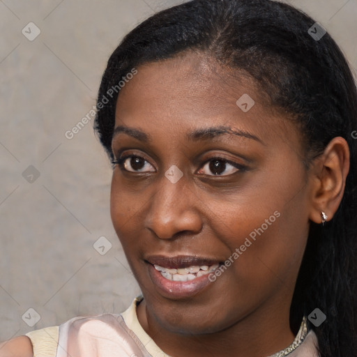 Joyful black young-adult female with short  black hair and brown eyes