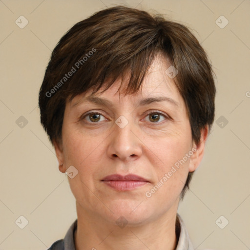 Joyful white adult female with short  brown hair and brown eyes