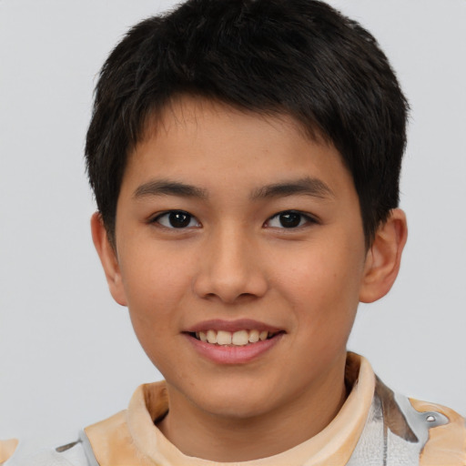 Joyful white child male with short  brown hair and brown eyes
