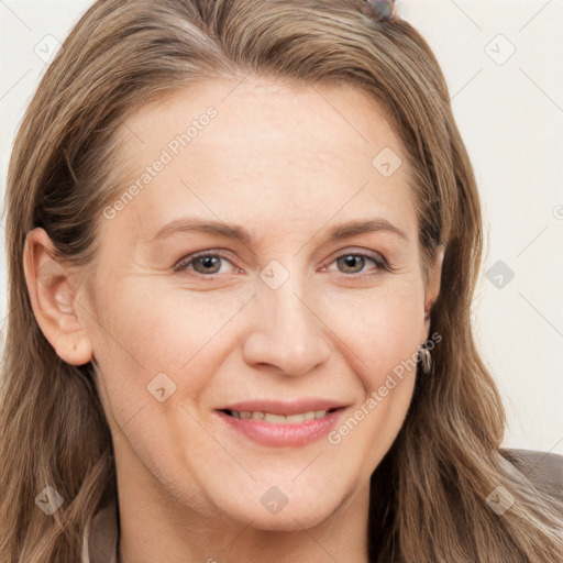 Joyful white adult female with long  brown hair and brown eyes