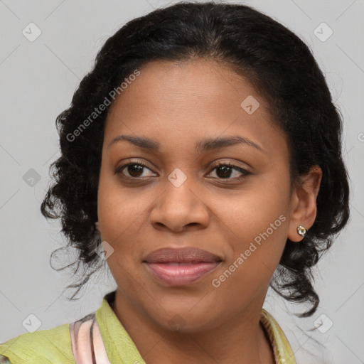 Joyful black young-adult female with long  brown hair and brown eyes