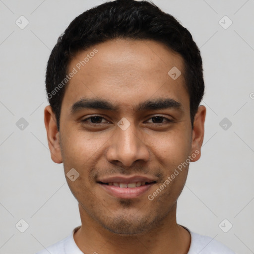 Joyful latino young-adult male with short  black hair and brown eyes