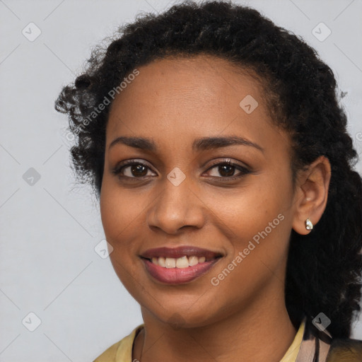 Joyful black young-adult female with long  brown hair and brown eyes