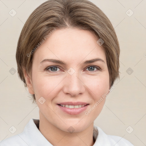 Joyful white young-adult female with short  brown hair and grey eyes