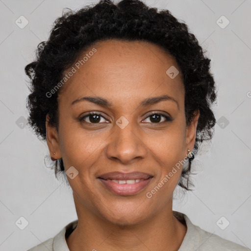 Joyful black adult female with short  brown hair and brown eyes