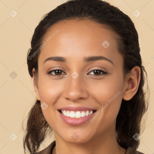 Joyful white young-adult female with long  brown hair and brown eyes