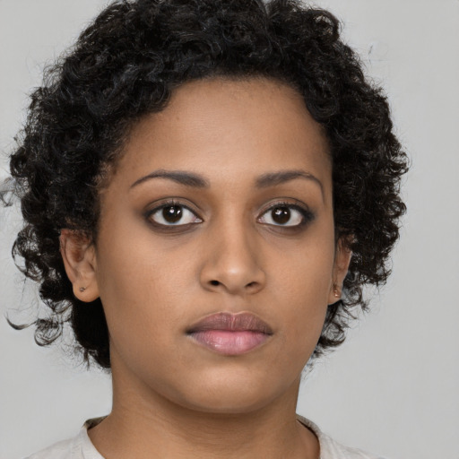 Neutral black young-adult female with short  brown hair and brown eyes
