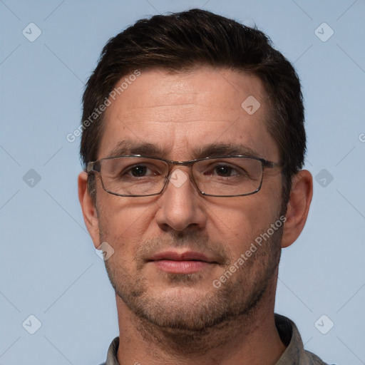 Joyful white adult male with short  brown hair and brown eyes