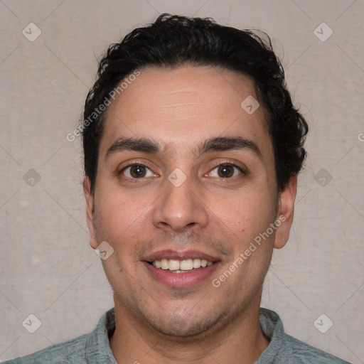 Joyful white young-adult male with short  black hair and brown eyes