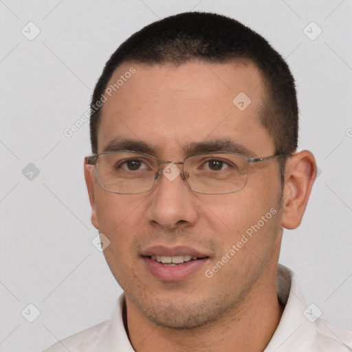 Joyful white young-adult male with short  black hair and brown eyes