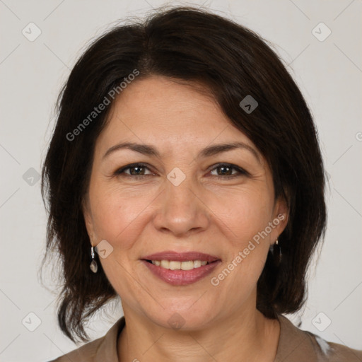 Joyful white adult female with medium  brown hair and brown eyes