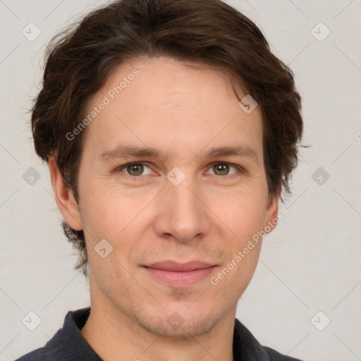 Joyful white adult male with short  brown hair and grey eyes