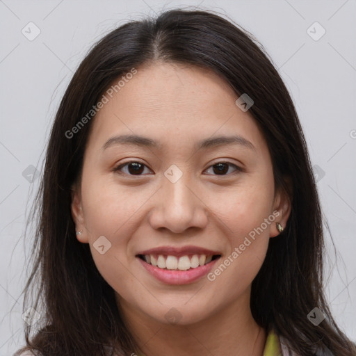 Joyful white young-adult female with long  brown hair and brown eyes