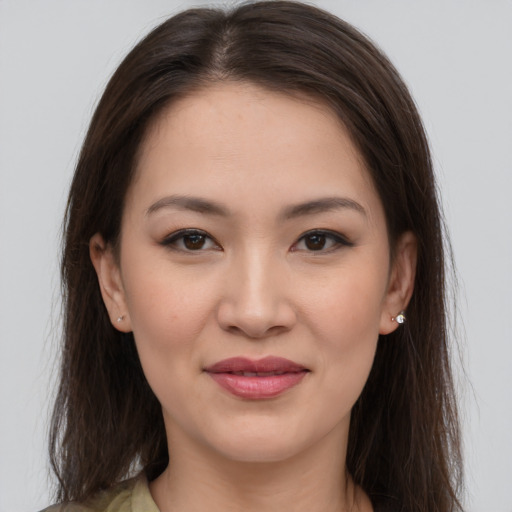 Joyful white young-adult female with medium  brown hair and brown eyes