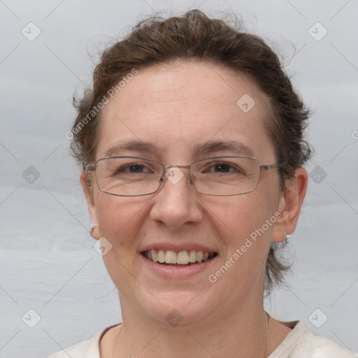 Joyful white adult female with short  brown hair and grey eyes