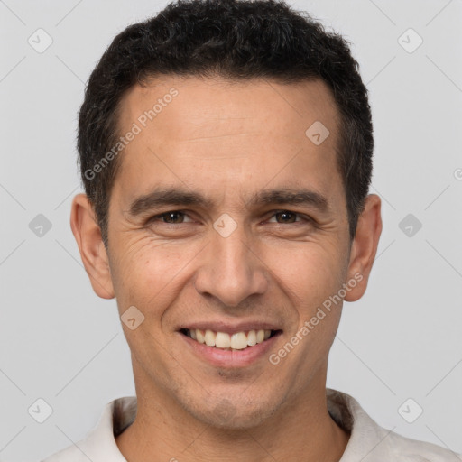 Joyful white adult male with short  brown hair and brown eyes