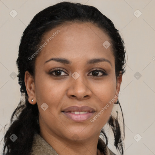 Joyful black young-adult female with long  brown hair and brown eyes