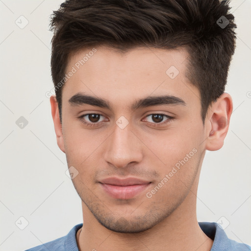 Joyful white young-adult male with short  brown hair and brown eyes