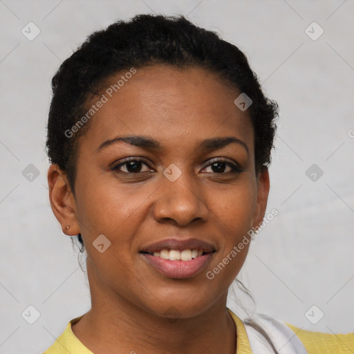 Joyful black young-adult female with short  brown hair and brown eyes