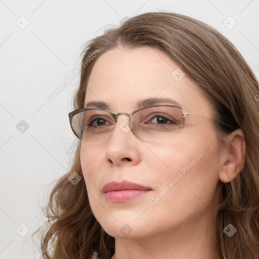 Joyful white young-adult female with long  brown hair and blue eyes