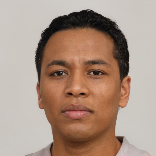 Neutral latino young-adult male with short  black hair and brown eyes