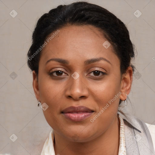 Joyful latino adult female with short  brown hair and brown eyes