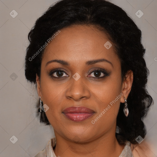 Joyful black adult female with medium  brown hair and brown eyes