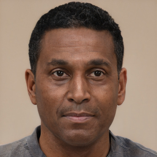 Neutral latino adult male with short  black hair and brown eyes