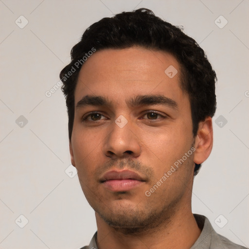 Neutral white young-adult male with short  black hair and brown eyes