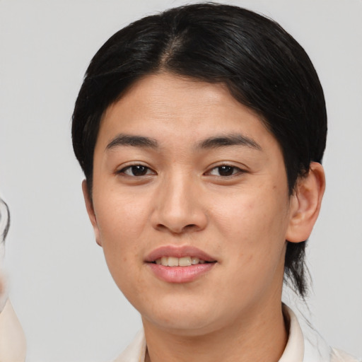 Joyful latino young-adult female with medium  black hair and brown eyes