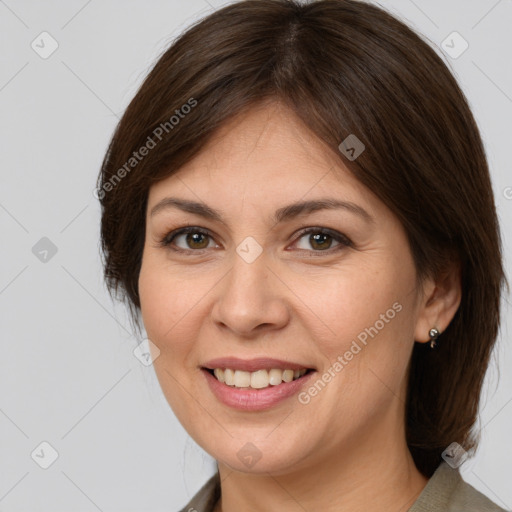 Joyful white adult female with medium  brown hair and brown eyes