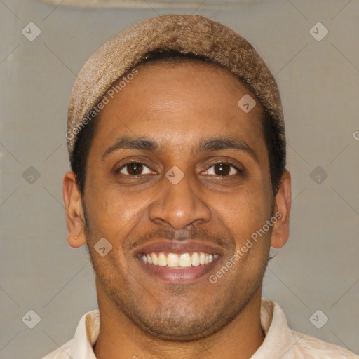 Joyful latino young-adult male with short  brown hair and brown eyes