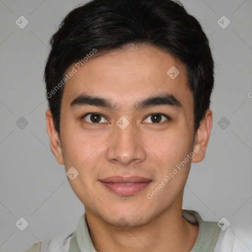 Joyful asian young-adult male with short  brown hair and brown eyes