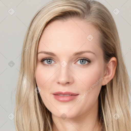 Joyful white young-adult female with long  brown hair and blue eyes