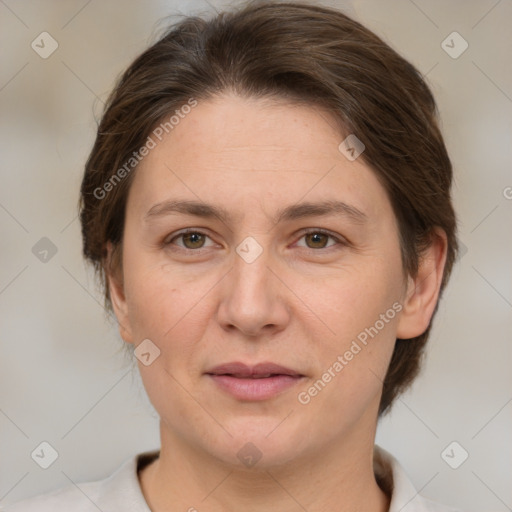 Joyful white adult female with medium  brown hair and brown eyes