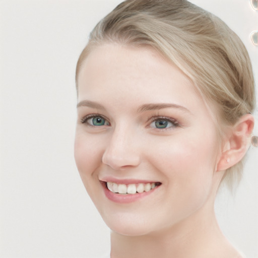 Joyful white young-adult female with short  brown hair and blue eyes