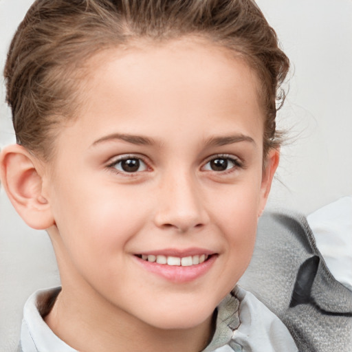 Joyful white child female with short  brown hair and brown eyes