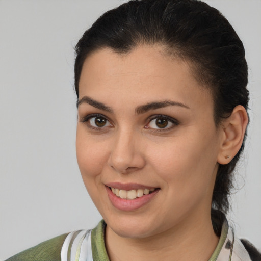 Joyful white young-adult female with medium  brown hair and brown eyes