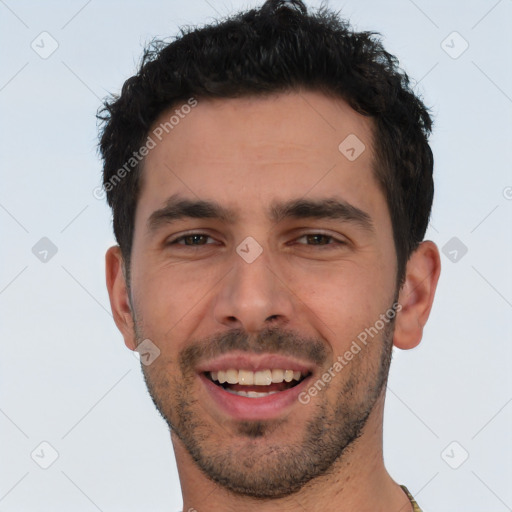 Joyful white young-adult male with short  black hair and brown eyes