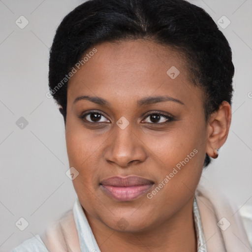 Joyful black young-adult female with short  brown hair and brown eyes