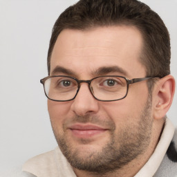 Joyful white adult male with short  brown hair and brown eyes