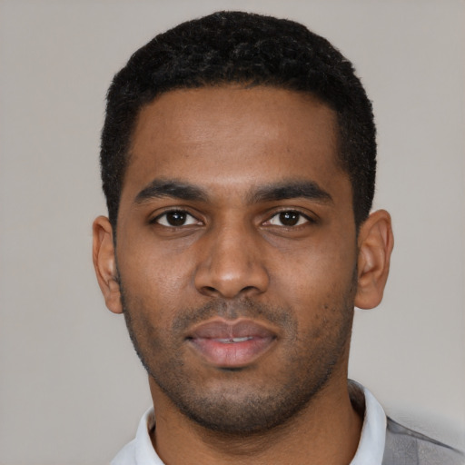 Neutral black young-adult male with short  black hair and brown eyes