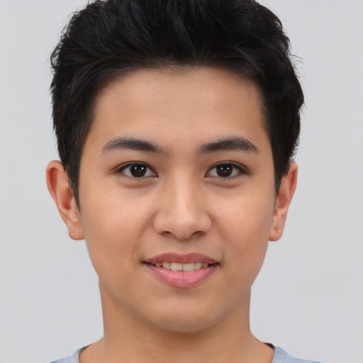 Joyful asian young-adult male with short  brown hair and brown eyes