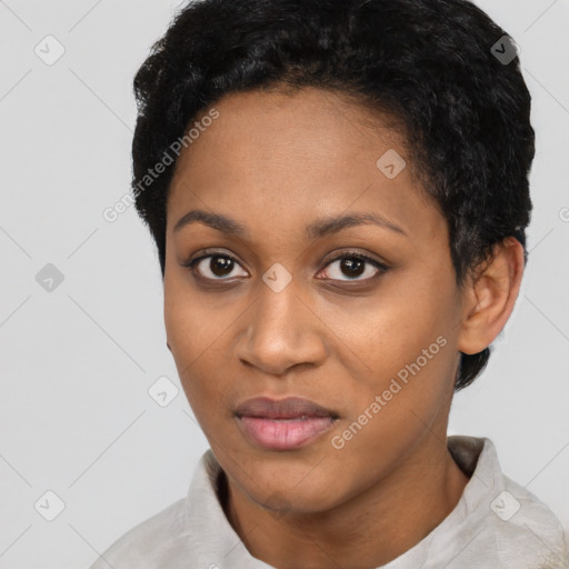 Joyful black young-adult female with short  black hair and brown eyes