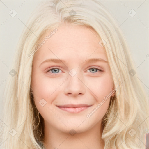 Joyful white young-adult female with long  blond hair and blue eyes