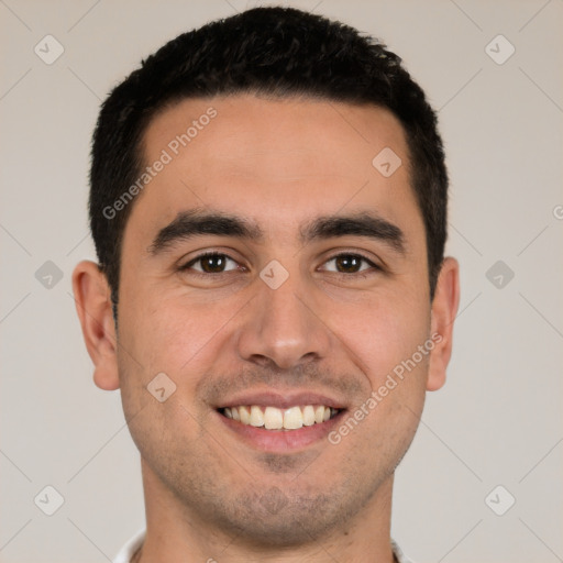 Joyful white young-adult male with short  black hair and brown eyes