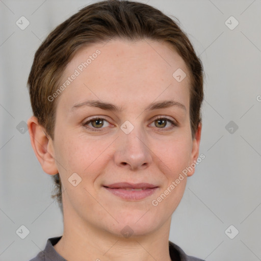 Joyful white young-adult female with short  brown hair and grey eyes