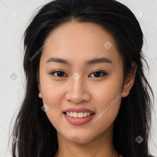 Joyful asian young-adult female with long  brown hair and brown eyes